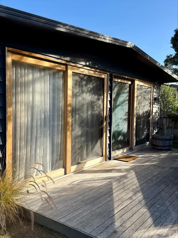 a screened in porch of a house with windows at Casa Piccolo - Peninsula Hot Springs 5 mins away in Rye