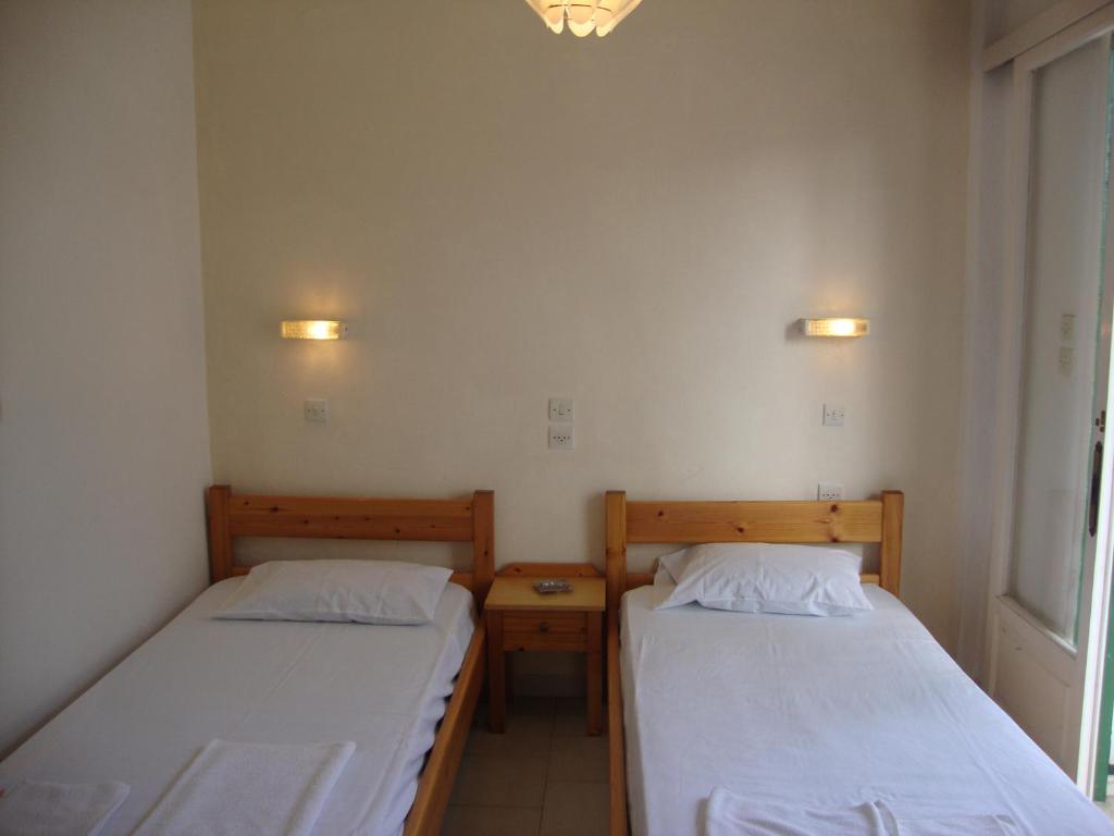 A bed or beds in a room at Alex Apartments