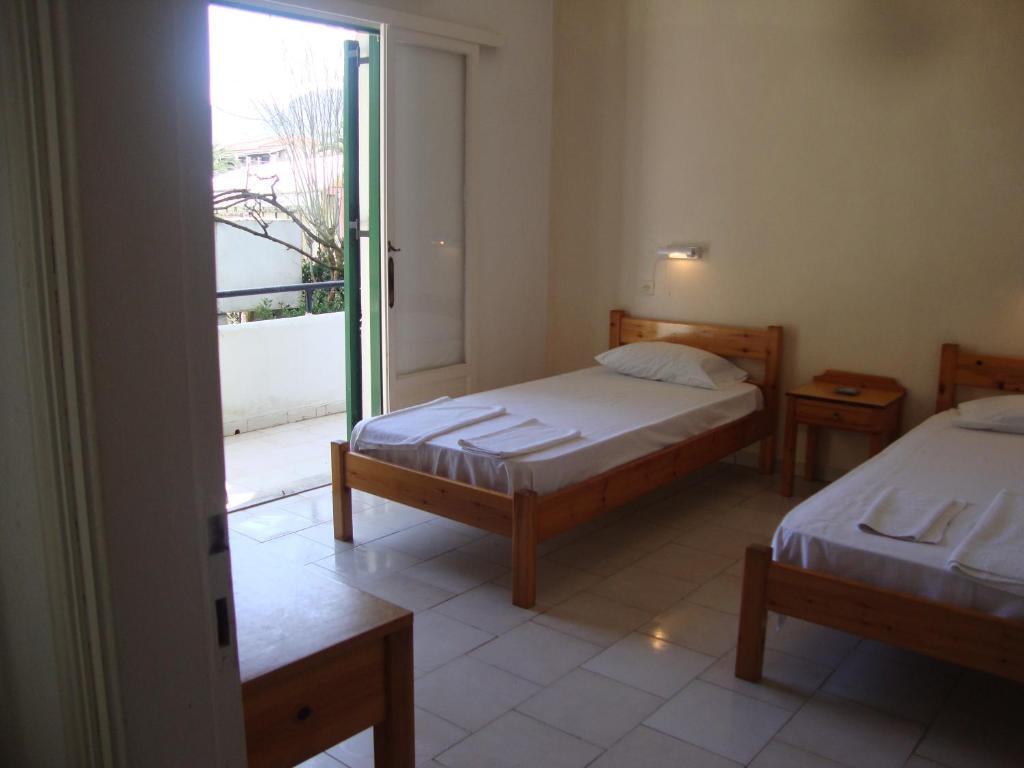 A bed or beds in a room at Alex Apartments