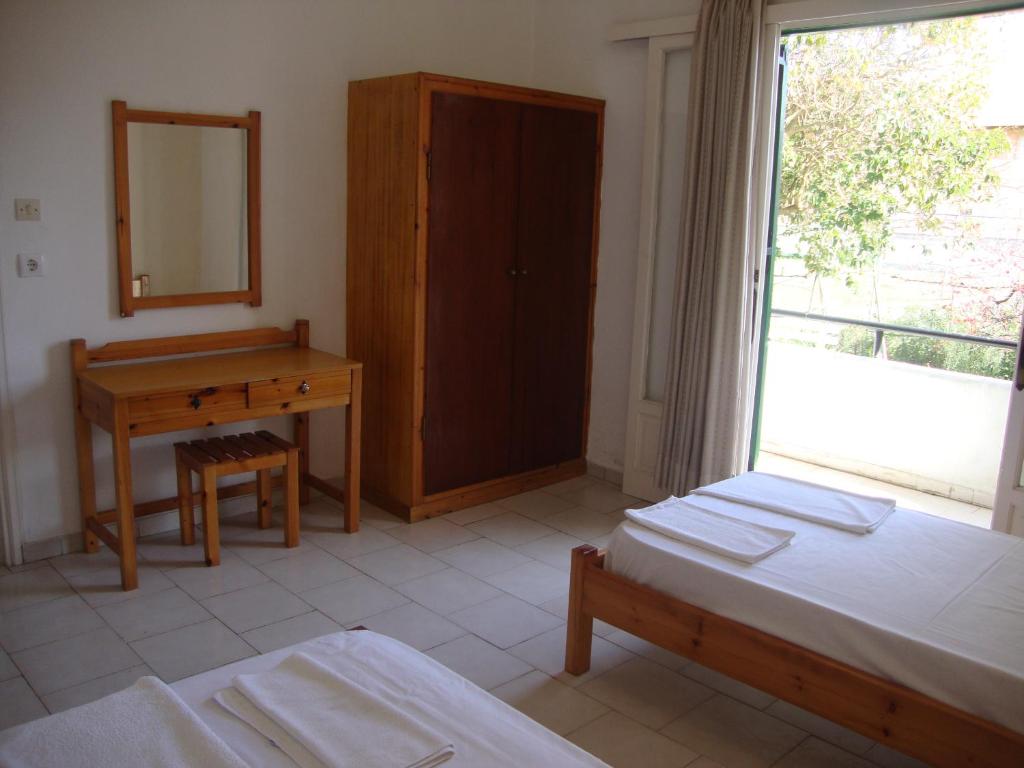 A bed or beds in a room at Alex Apartments