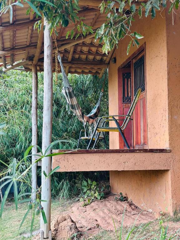 a chair sitting on a porch of a house at Varanda do Vale in Palmas