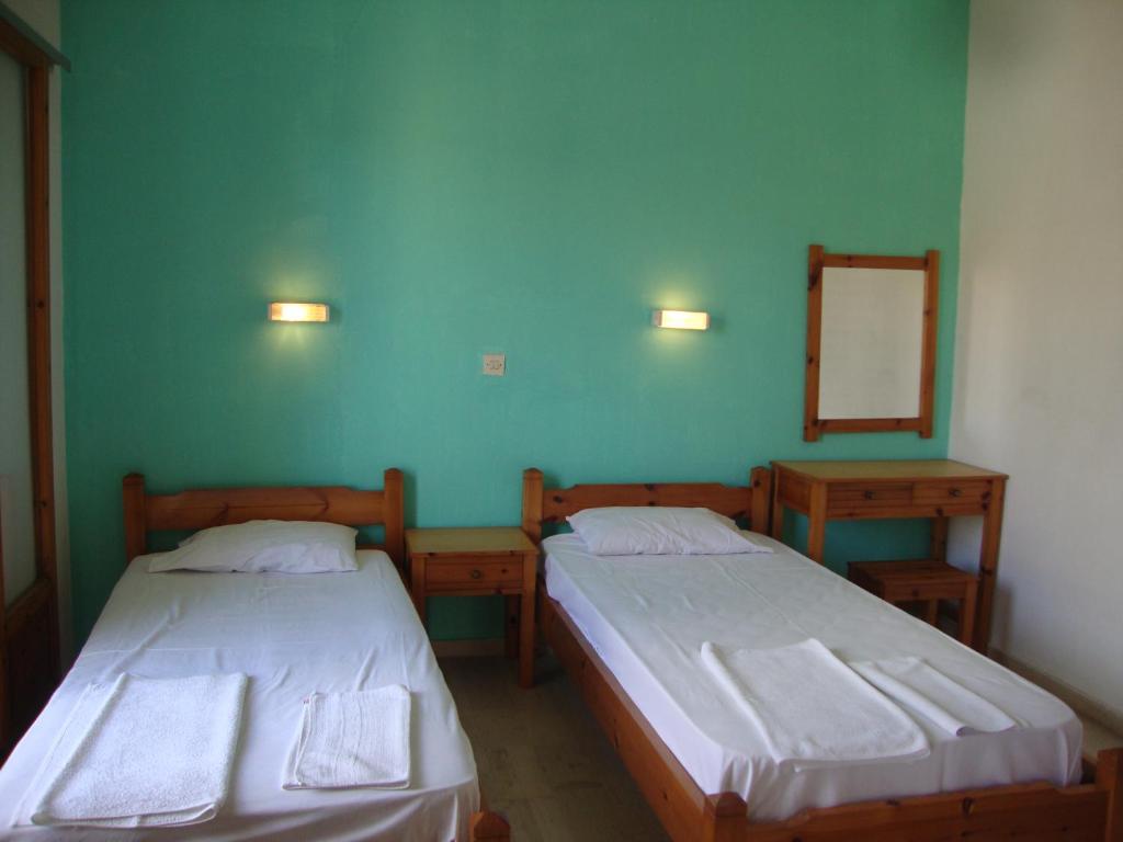 A bed or beds in a room at Alex Apartments