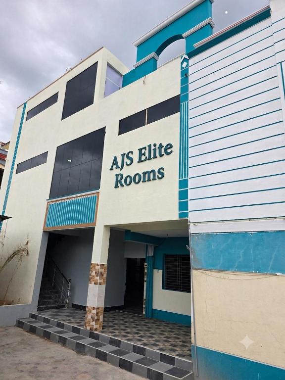 a building with a sign that reads as elite rooms at AJS Elite Rooms in Nagari