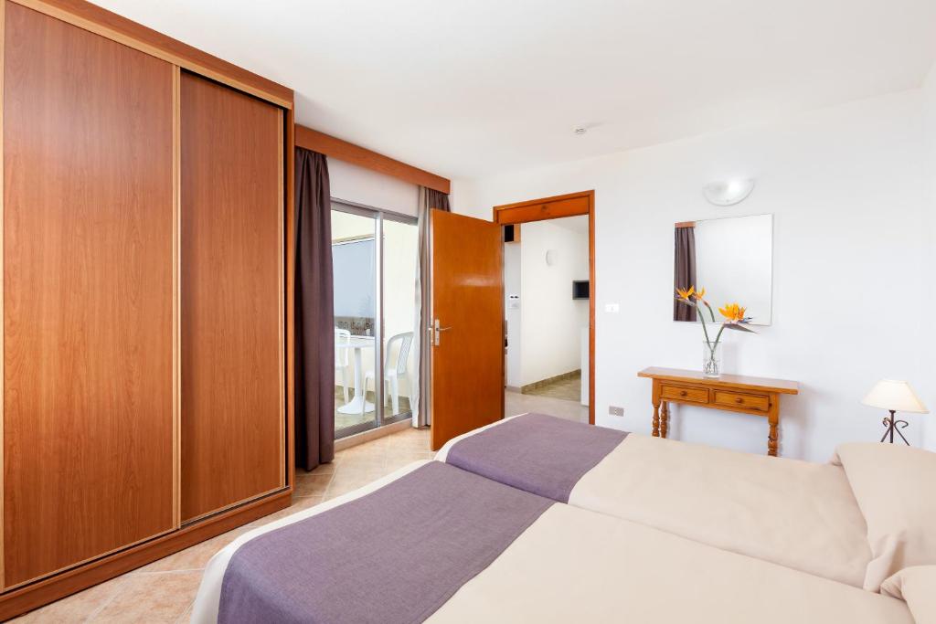 Postel nebo postele na pokoji v ubytování Hotel Panoramica Garden