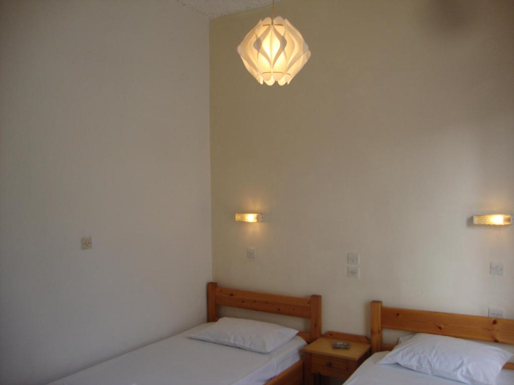A bed or beds in a room at Alex Apartments