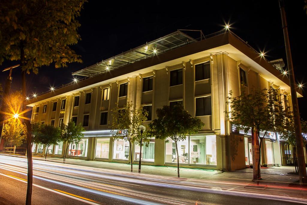 a building on a city street at night at Gosterisli Otel in Duzce