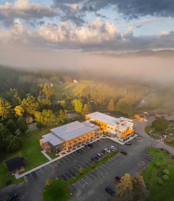 an aerial view of a building with a parking lot at Sun & Ski Inn and Suites in Stowe