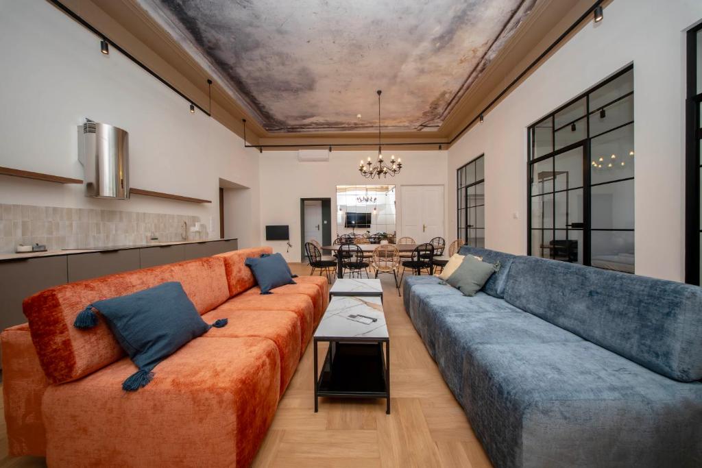 a living room with a couch and a table at Slawkowska No 6 Residence in Krakow