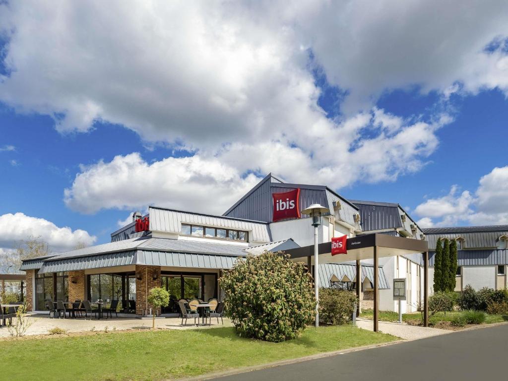 a building with a sign on the front of it at ibis Amboise in Amboise