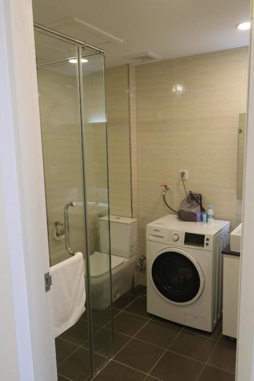 Koupelna v ubytování CA&SA Serviced Apartment