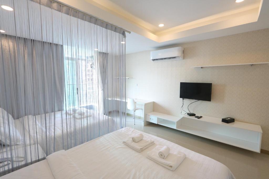 Postel nebo postele na pokoji v ubytování CA&SA Serviced Apartment