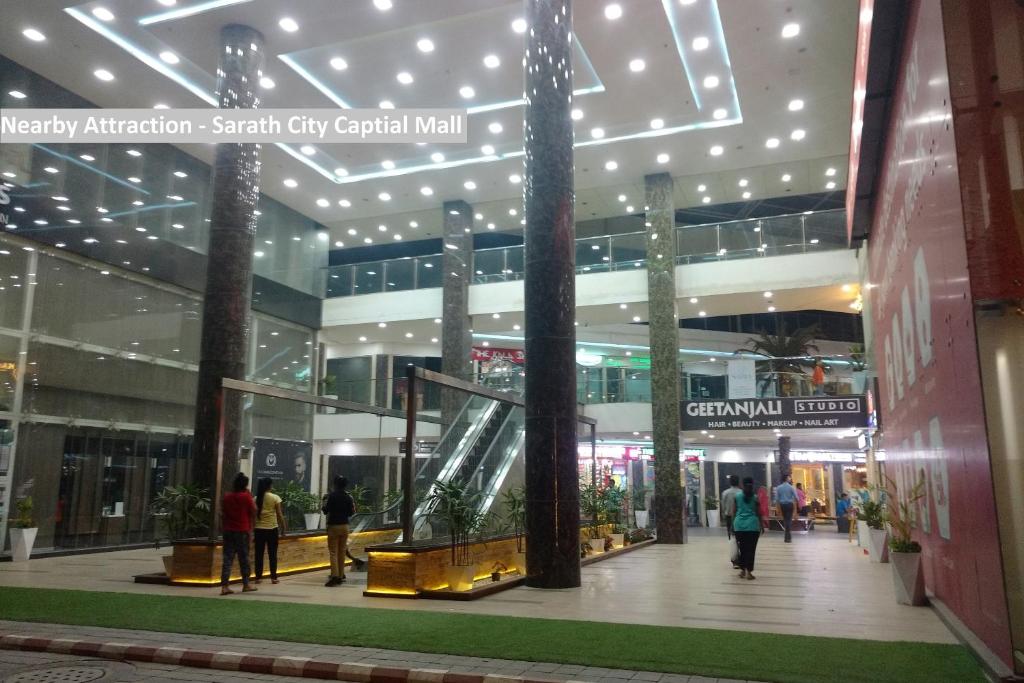 a shopping mall with people walking in it at Super Hotel O Rudra Grand in Hyderabad