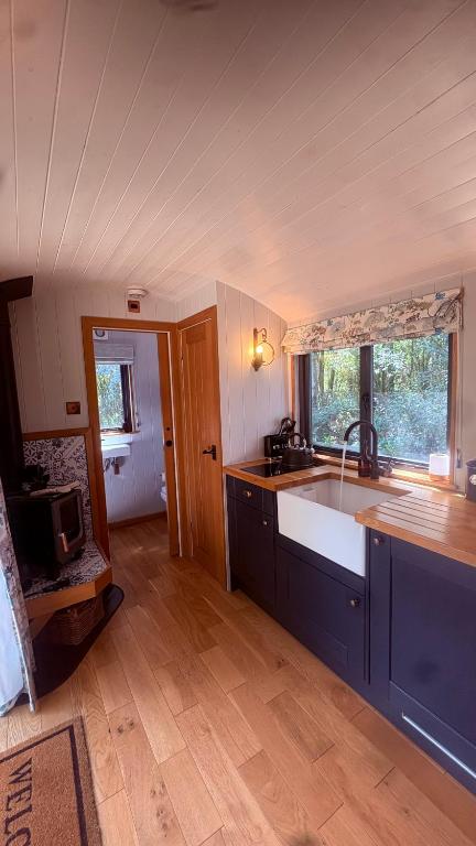 a kitchen with a sink and a counter top at Oakwood Marina in Northwich