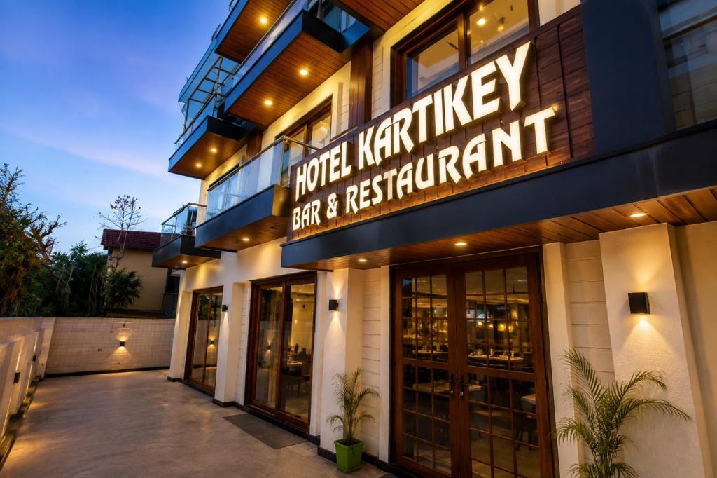 a building with a sign that reads hotel karwrightasy spa and restaurant at Hotel Kartikey Near Jio Centre in Sundarnagar