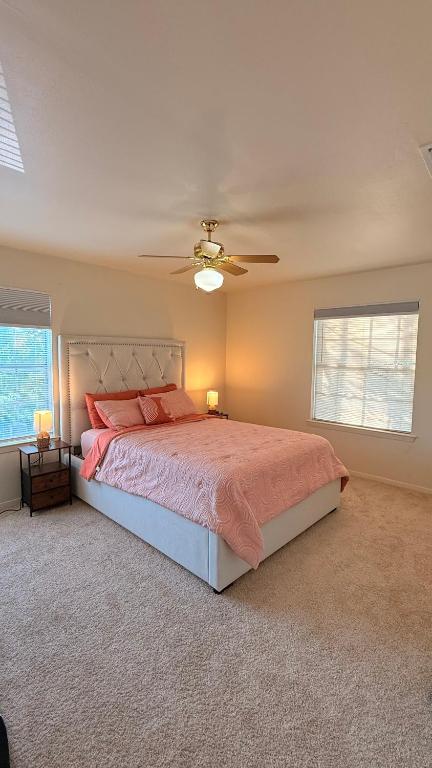 a bedroom with a bed and a ceiling fan at My apartment in Georgetown 2 Bedroom in Georgetown