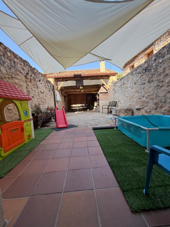 a play area with a ping pong table at Casa del Tío Marcelo in Pedraza-Segovia