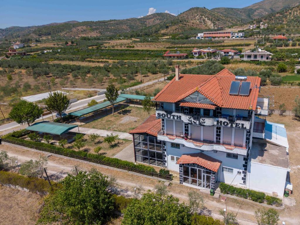 an aerial view of a house with an orange roof at South Hotel Berat in Uznovë