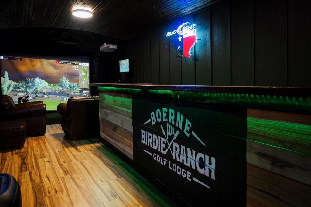 a bar with avertisement for at Boerne Birdie Ranch in Boerne