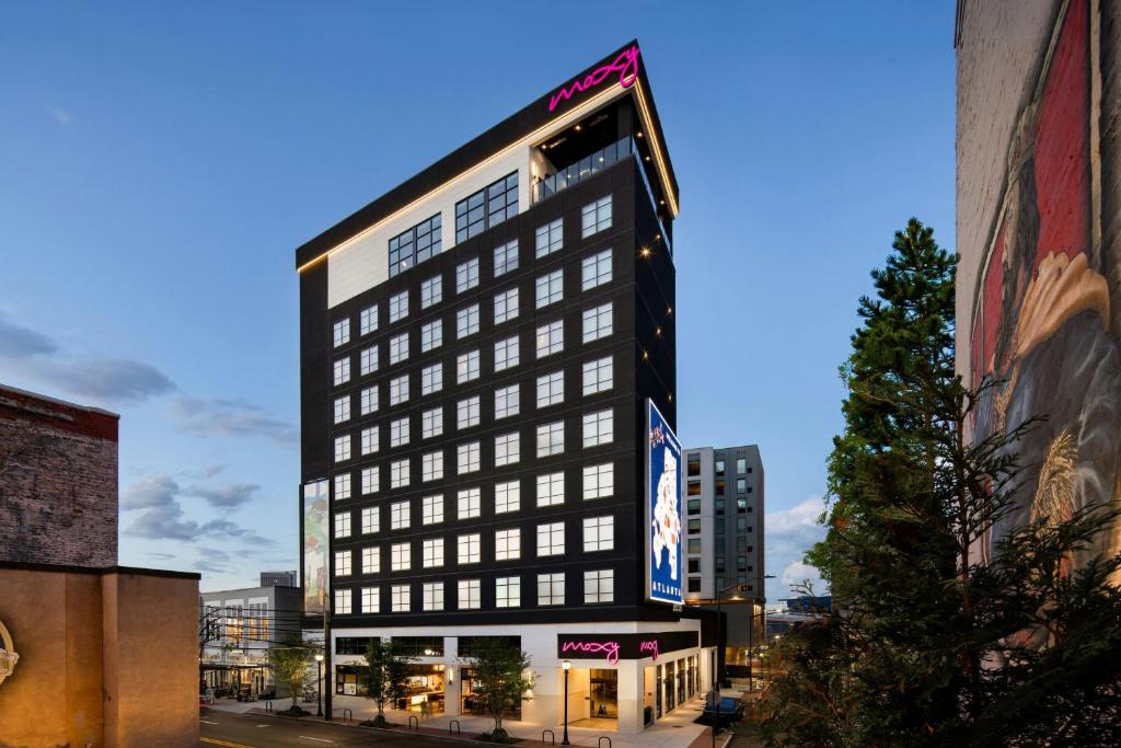 a tall black building on a city street at Moxy Atlanta Downtown in Atlanta