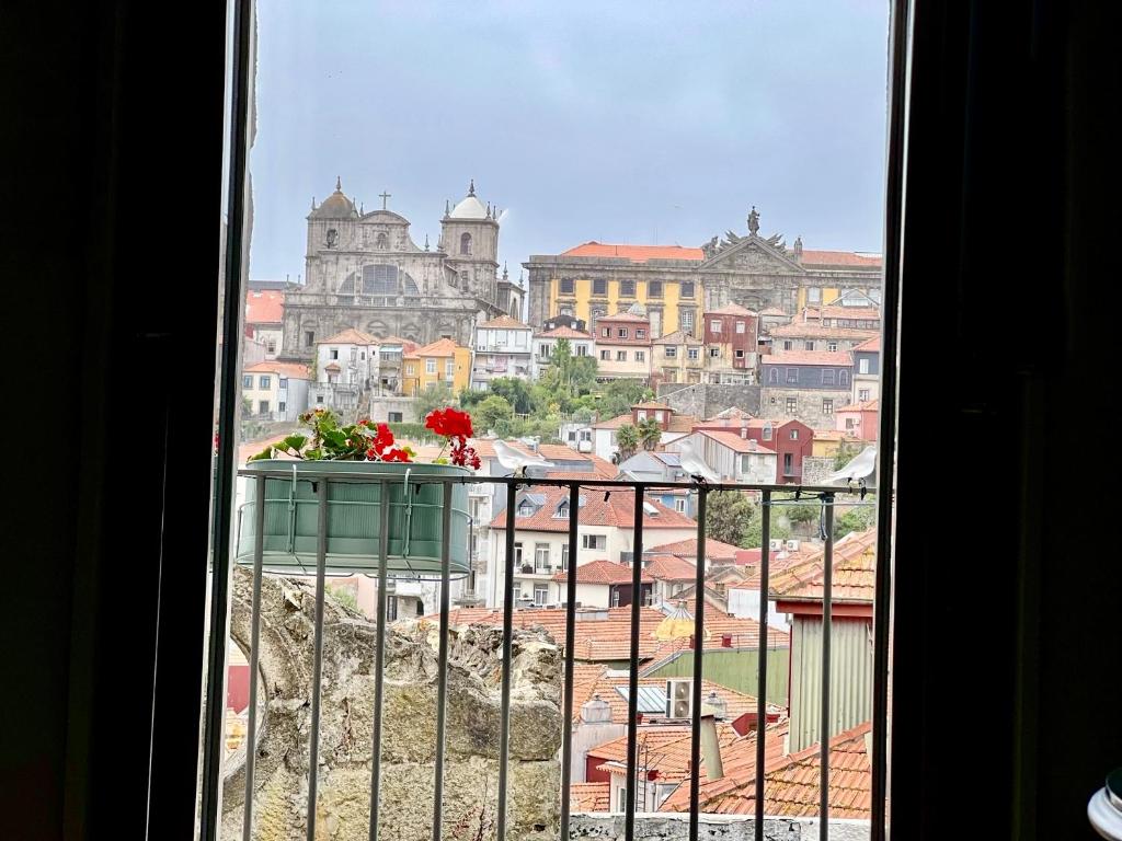 a view of a city from a window at Urban Apartment Casa da Portela in Porto