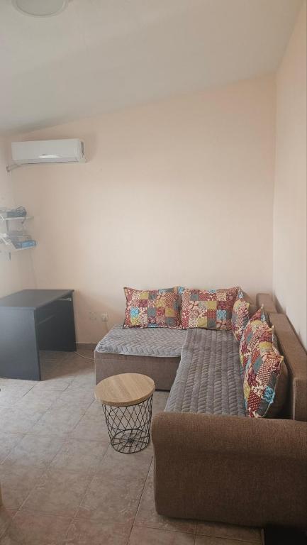 a living room with a couch and a table at Apartman Andrej in Bar