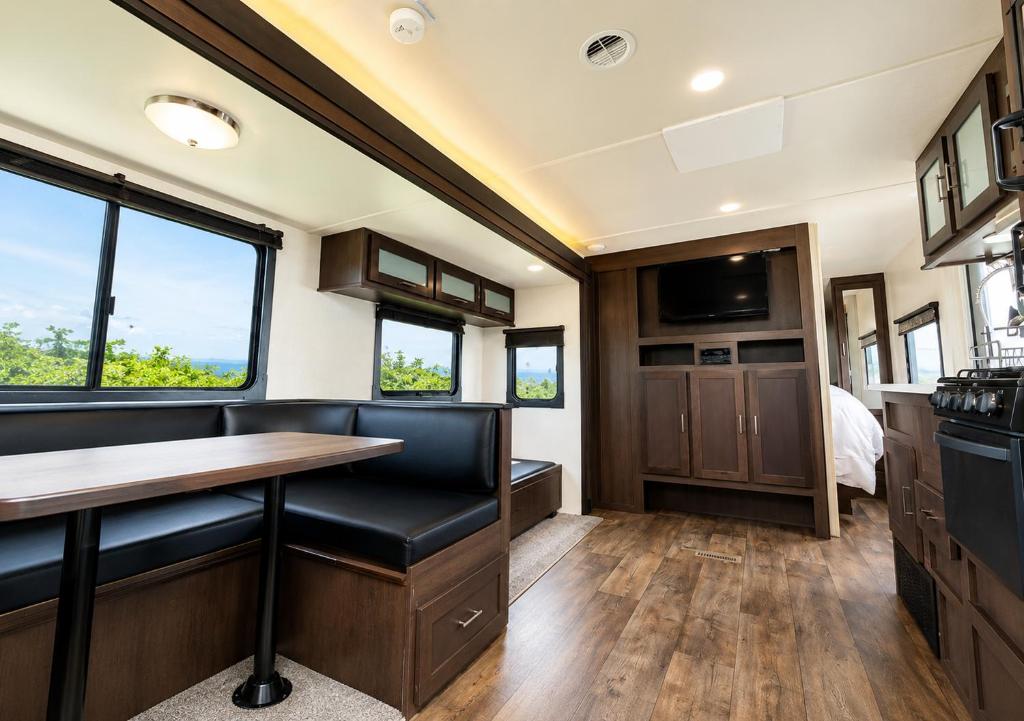 a kitchen and living room of a recreational vehicle at NaturalfarmZAMPA in Yomitan