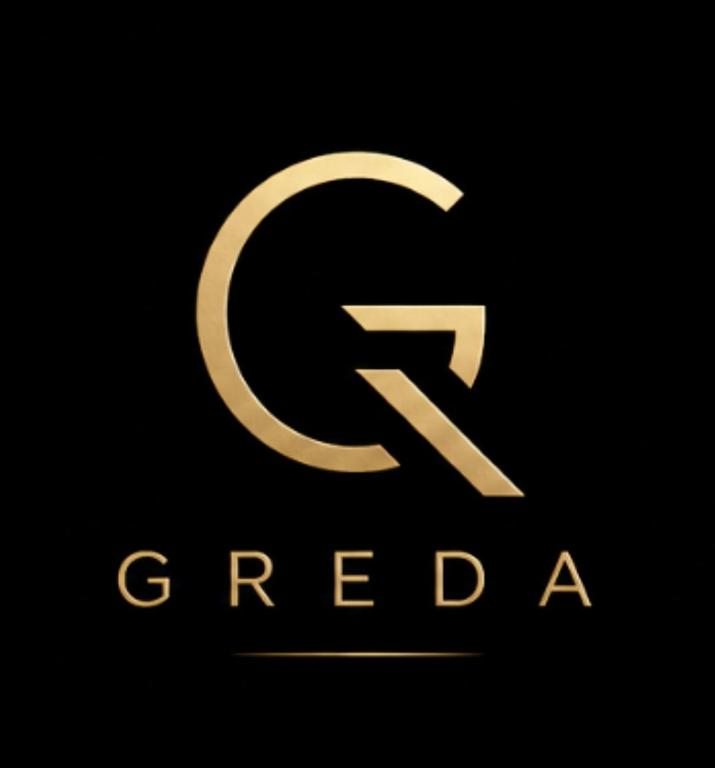 ein weißes C-Logo auf schwarzem Hintergrund in der Unterkunft GreDa in Malia