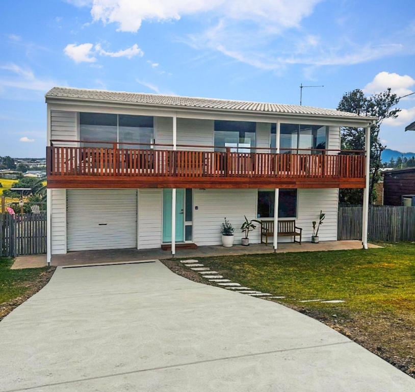 a large house with a deck on top of it at 39 Scenic Drive in Bermagui
