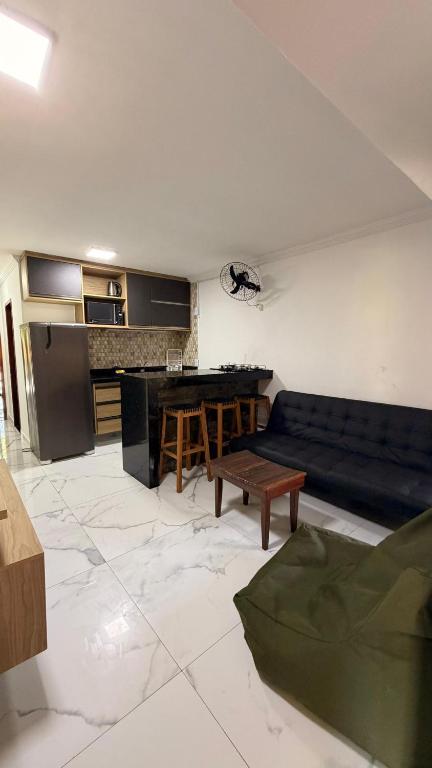a living room with a couch and a table at 204 Eco Paradise Cumbuco in Caucaia