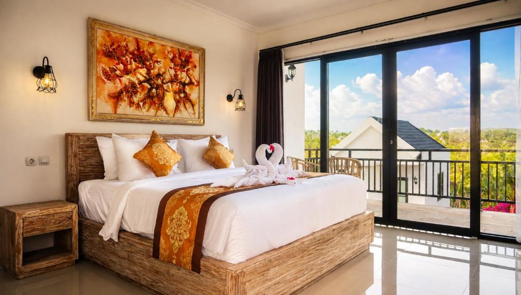 a bedroom with a bed with a swan on it at Penida Cabins in Nusa Penida
