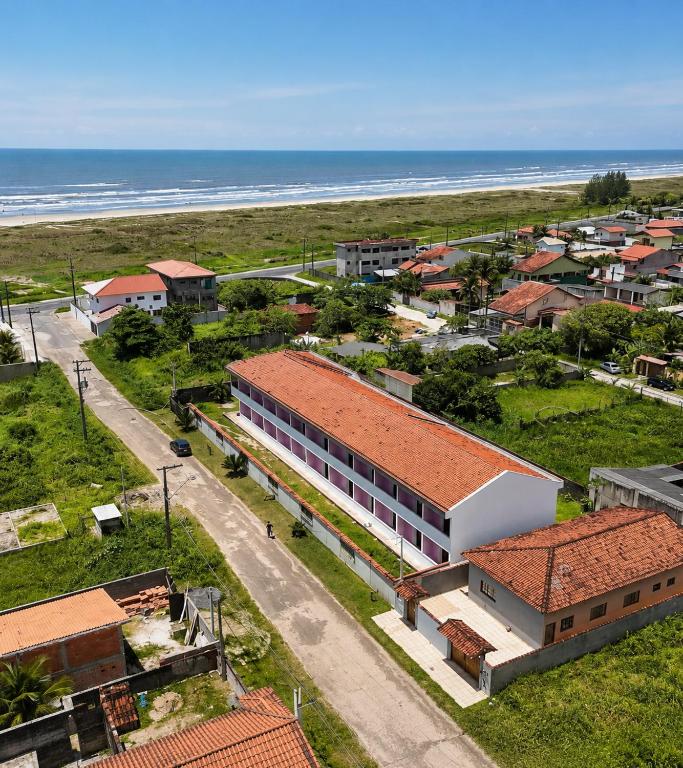 an aerial view of a town with the beach at Flat à Beira Mar na Ilha Comprida in Ilha Comprida