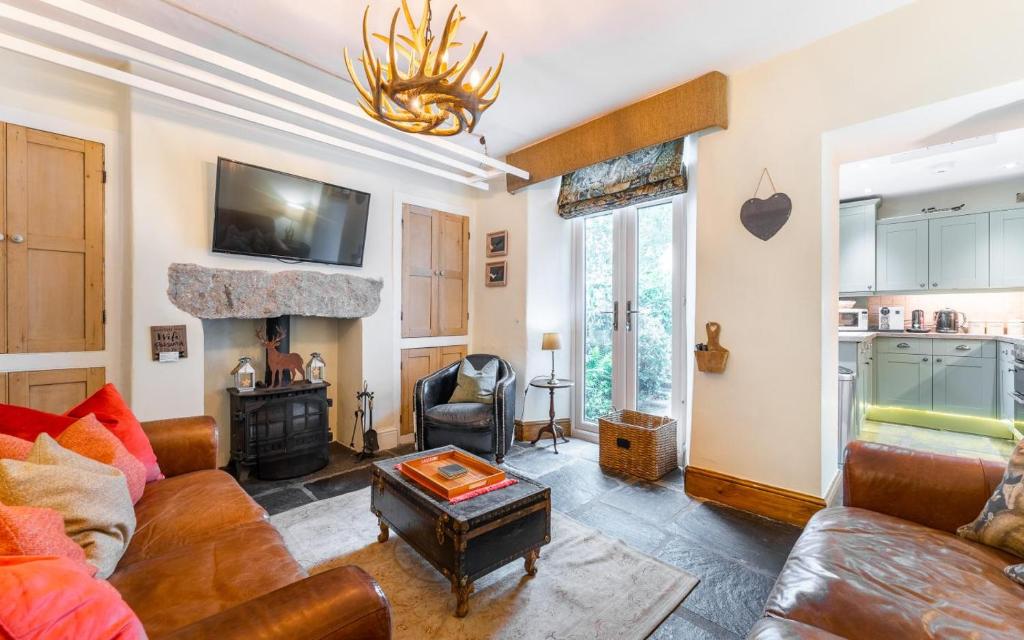 a living room with a couch and a table at 3 Bed in Windermere oc-lr164 in Windermere
