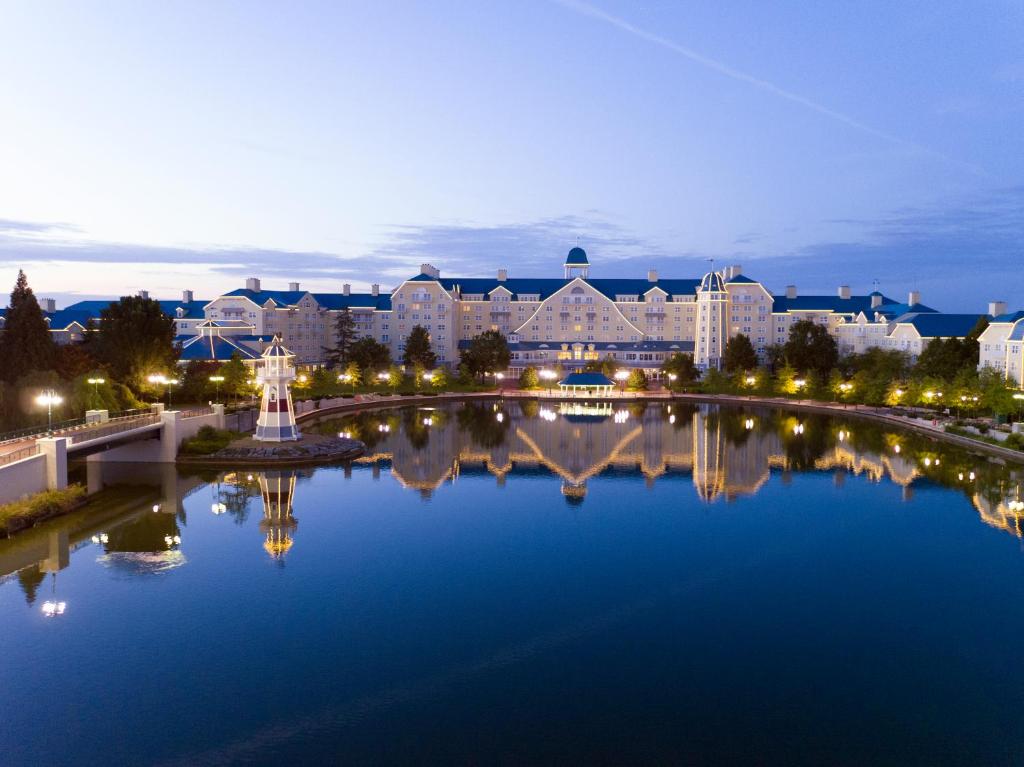 a large body of water with a clock tower at Disney's Newport Bay Club® in Chessy