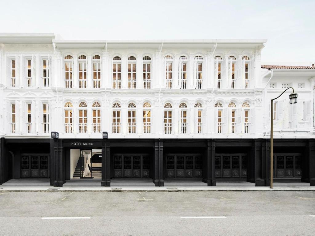 a large white building with a lot of windows at Hotel Mono in Singapore