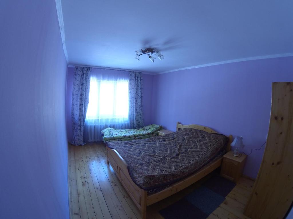 Postel nebo postele na pokoji v ubytování Садиба На лужку