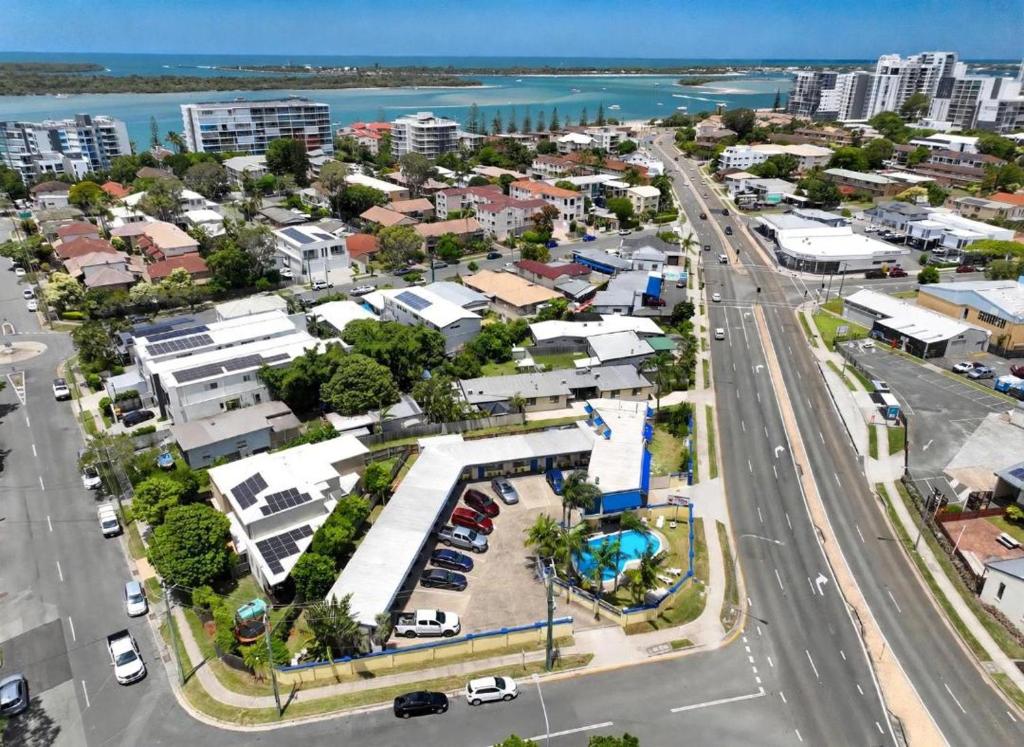 an aerial view of a city with a parking lot at Sunburst Motel in Gold Coast