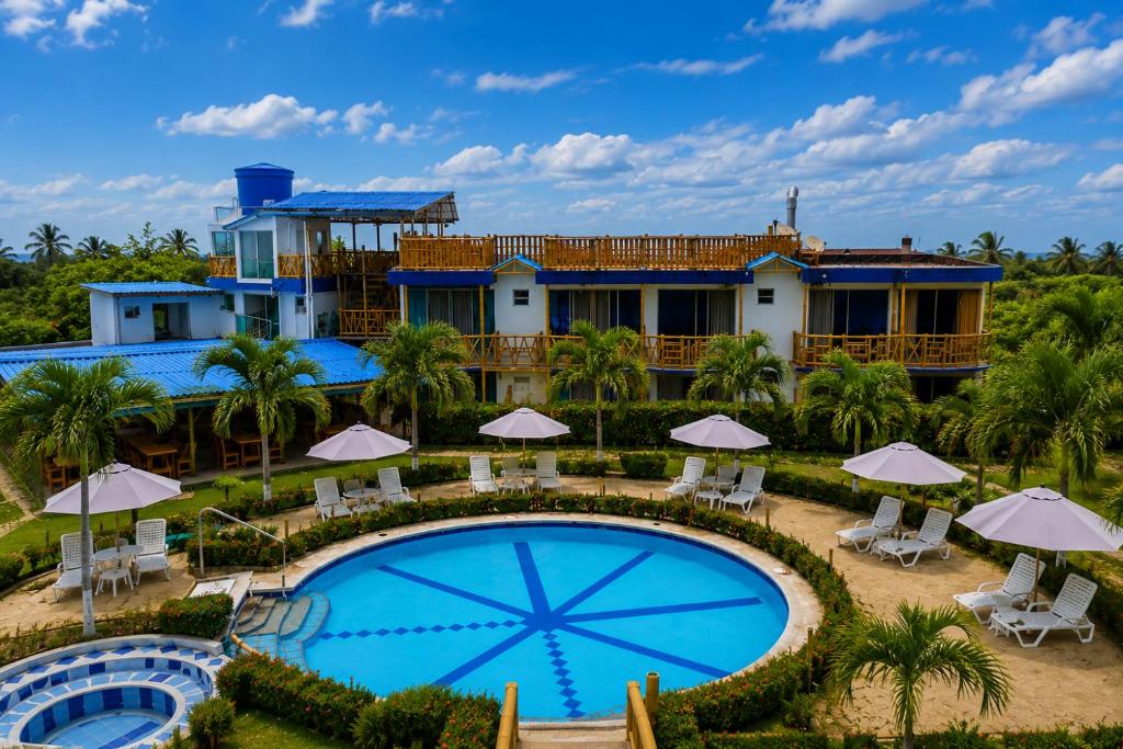 an aerial view of the resort with a swimming pool at La Rivera Playa Palomino in Palomino