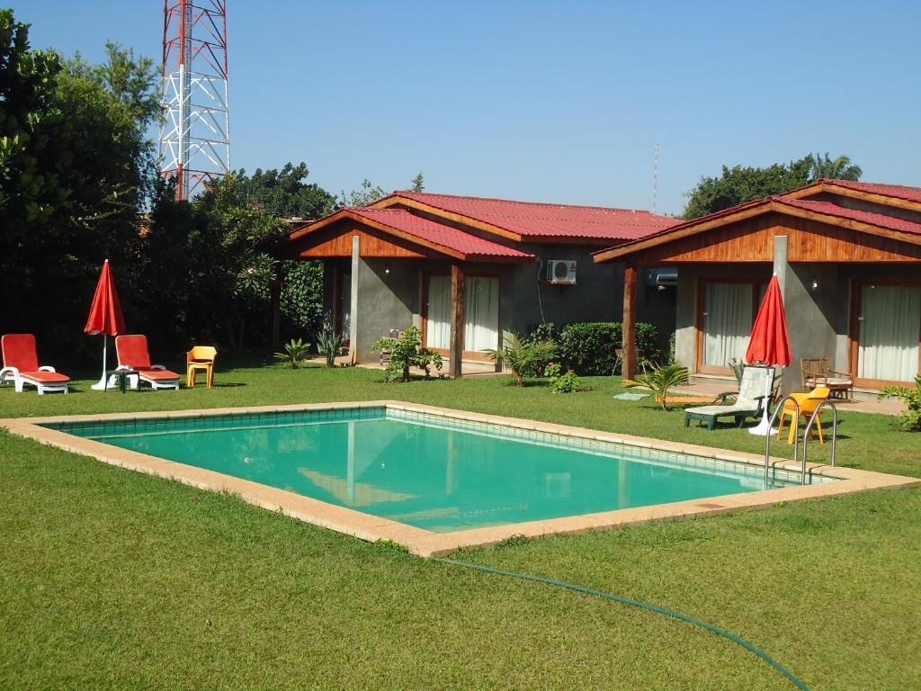 a swimming pool in the yard of a house at Planet Hotel HollyBum in Lubumbashi