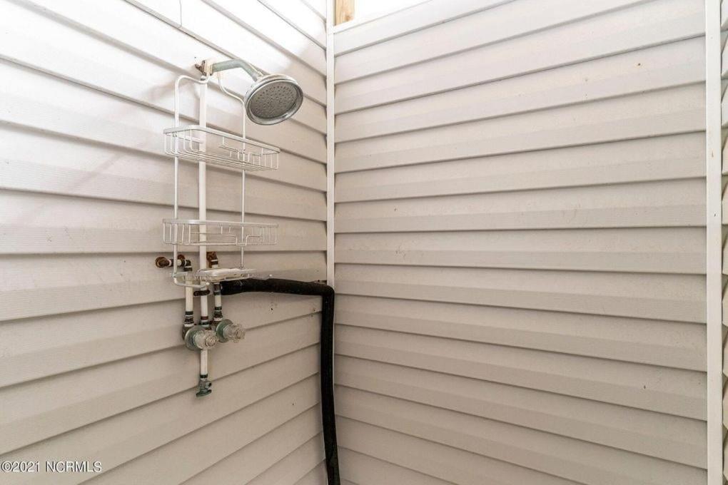 a shower in the corner of a house at Changes In Latitude home in Holden Beach