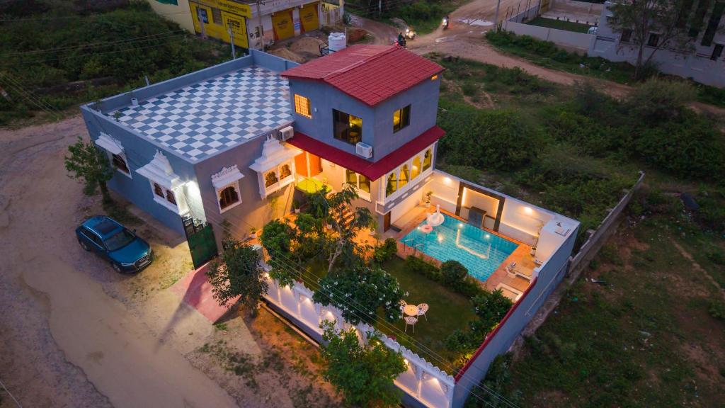 an overhead view of a house with a swimming pool at Next-stay in Udaipur