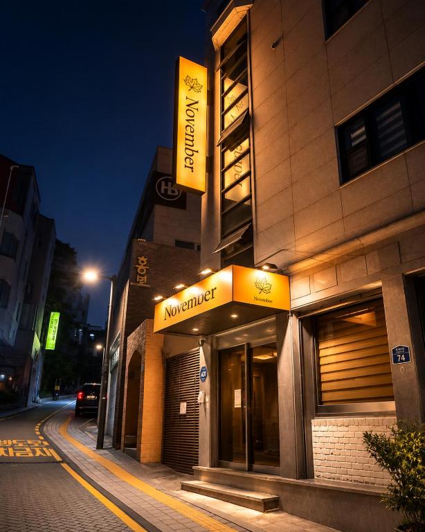 a building with a sign on the side of it at November Myeongdong in Seoul