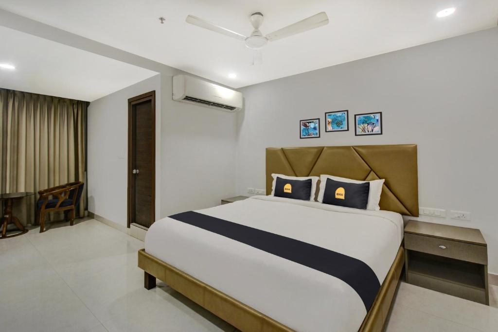 a bedroom with a large bed in a room at Hotel O D Suites in Hyderabad