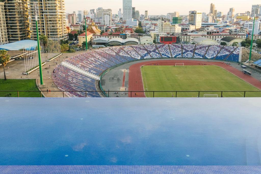 a view of a stadium with a soccer field at Stadion Residences in Phumĭ Prêk Chrey