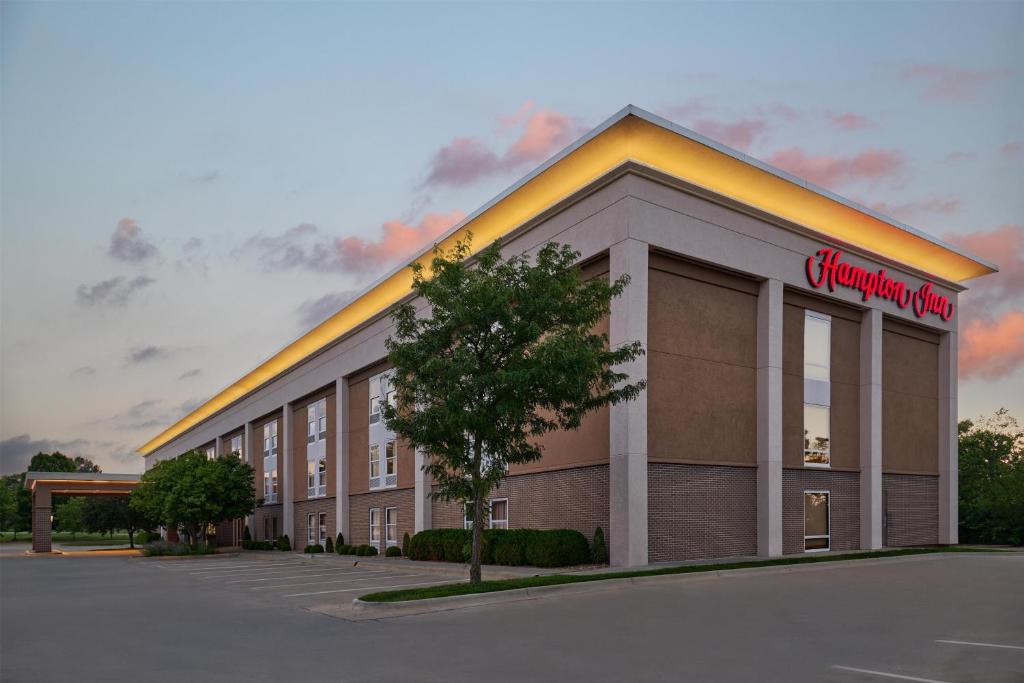 a rendering of a building with a store at Hampton Inn Lawrence in Lawrence