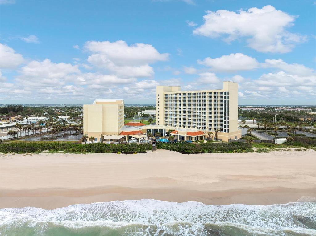 a view of the resort from the beach at Hilton Melbourne Beach Oceanfront in Melbourne