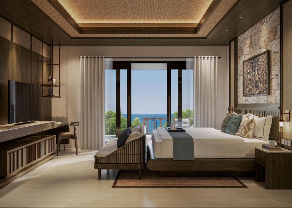 a bedroom with a bed and a large window at The Sankara Hill Penida in Sampalan