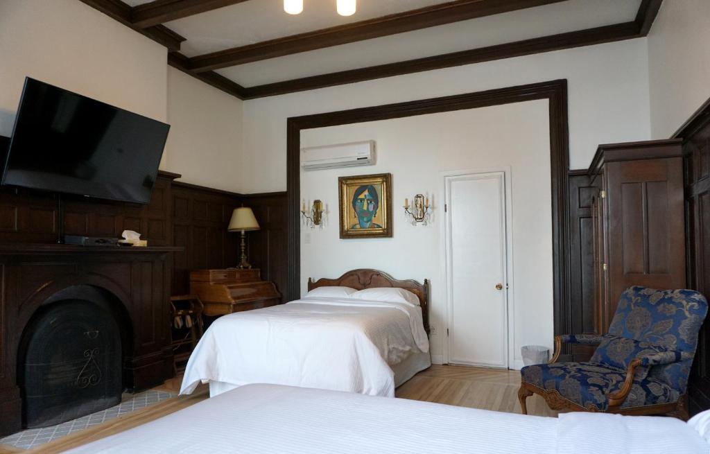 Postel nebo postele na pokoji v ubytování Hôtel Marie-Rollet