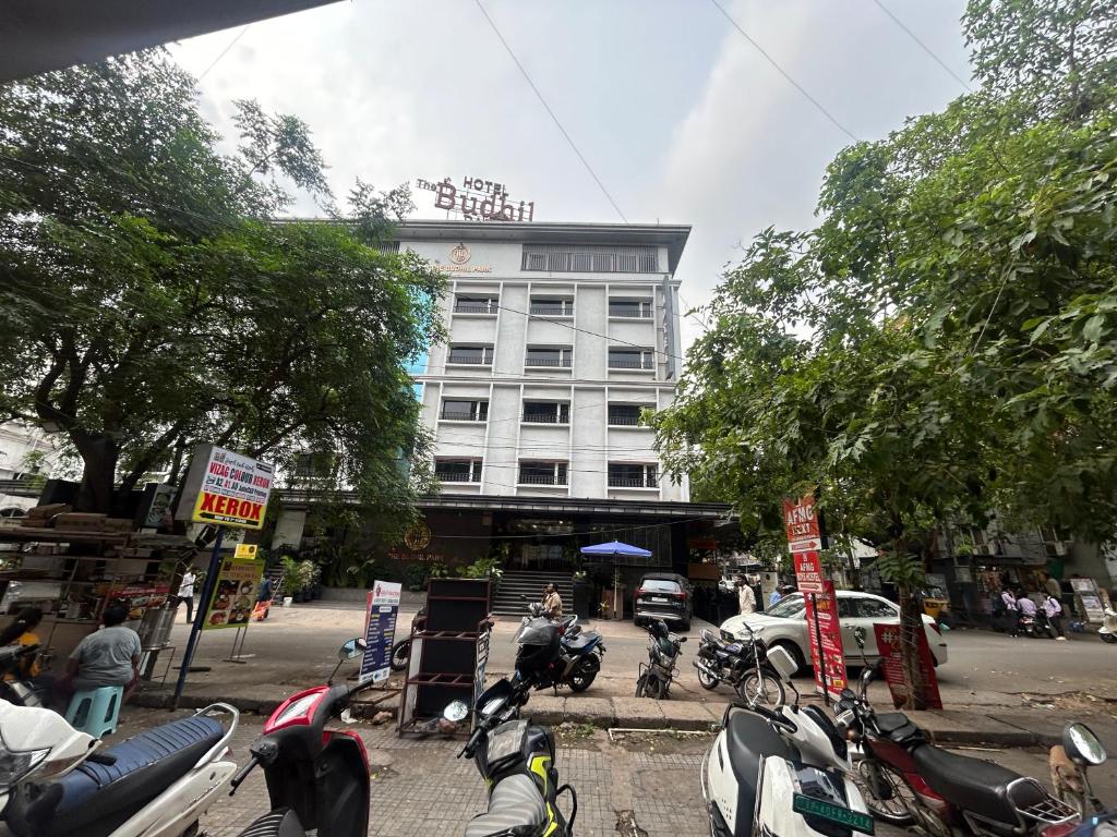 a group of motorcycles parked in front of a building at The Budhil Park in Visakhapatnam