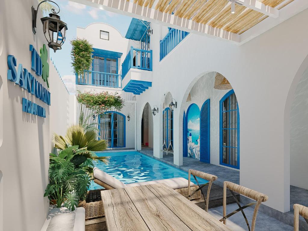 a courtyard with a swimming pool in a house at TD Santorini Pool Villa in Cổ Lưu (1)