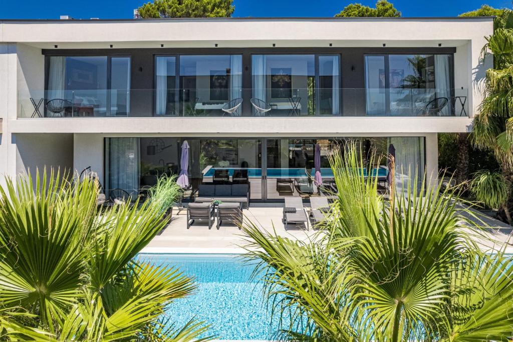an image of a house with a swimming pool at Luxury TABOO Villa & Spa in Medulin for 8 people with heated pool & wellness area in Medulin